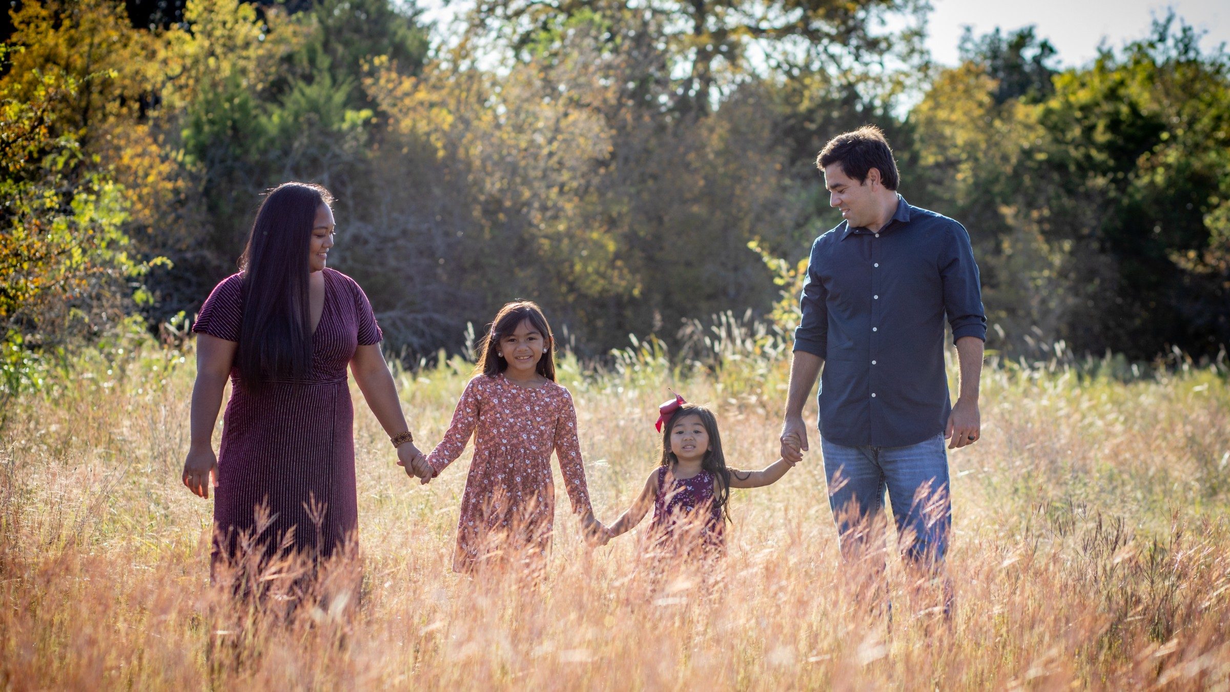 A family laughing together on a trail in Patapsco Valley